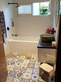 Moroccan inspired patterned tiles on bathroom floor 